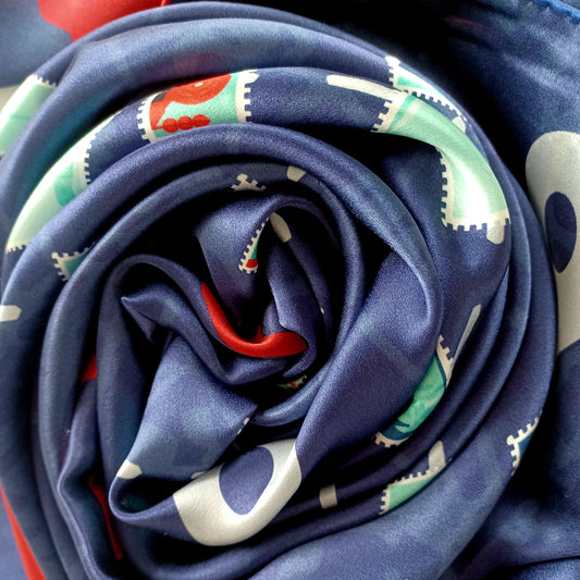 Alex Navy, Red, Teal & Coral Travel Inspired Silk Scarf scrunched up to see up close