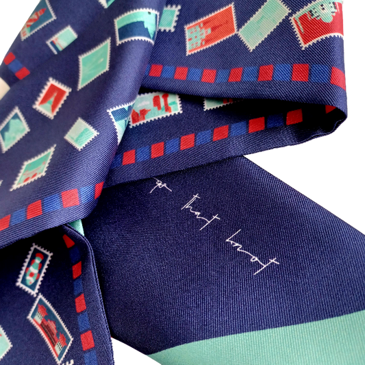 Navy & Red with Teal travel inspired stamps on a silk twill hair scarf up close